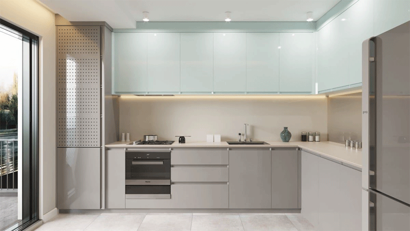 Mẫu 2: Không gian bếp đầy thoáng đãng, sáng sủa với bộ tủ bếp xám – xanh mint phủ Acrylic bóng gương